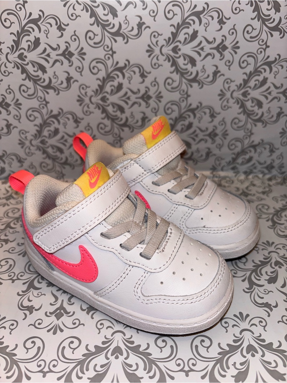Nike Kids White Sneakers with Pink Swoosh